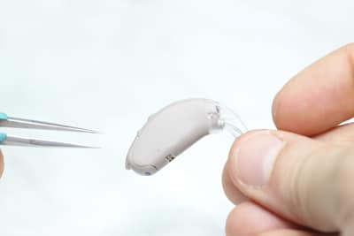 Regular Hearing Aid Servicing and Repairs Hearing care professional Performs Hearing Aid Servicing